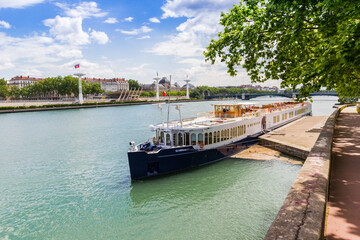 Cruise boat at the quay of the Rhone river in Lyon, France