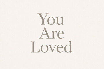 Minimalist beige background with elegant serif typography stating you are loved, perfect for Valentine's day greeting cards and romantic messages
