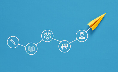 Paper airplane flying toward graduation following education path