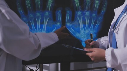 Medical staff team african american meeting discussing chest x-ray film Radiologists medical doctors that specialize in diagnosing, treating injuries, diseases, radiology, procedures exams, tests - Powered by Adobe