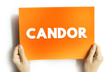 Candor text on card held by hands. Conceptual image symbolizing honesty, openness, sincerity, truth, integrity, and trust in communication, leadership, or workplace ethics