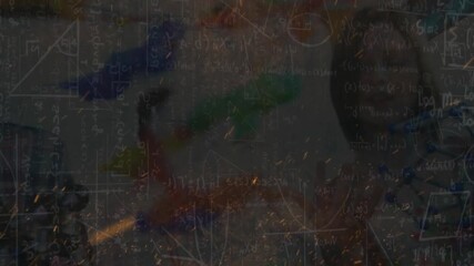 Animation of fire sparks over mathematical equations against diverse students in laboratory - Powered by Adobe