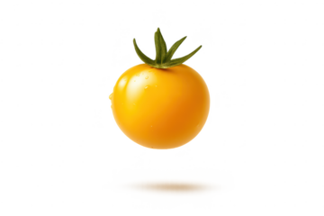 Ripe yellow tomato on transparent background - isolated close-up shot.