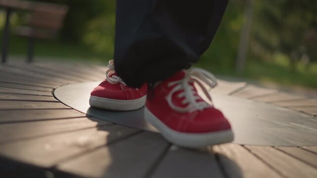 closeup red sneakers dancing on platform sunlit park setting, rhythmic footwork, playful hops and spins, bench and trees blurred in bokeh, warm lateafternoon glow, casual urban style, closeframe