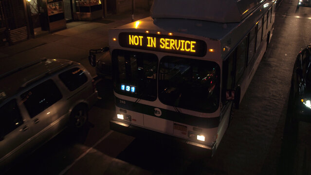 CLOSE UP: Public transport on busy New York streets in city center at night