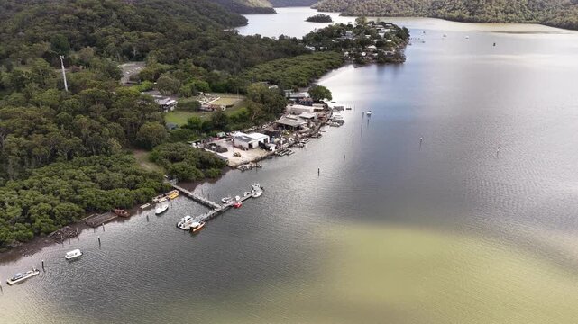 Wharf jetty to sky aerial vertical panorama of Mooney Mooney fishing village Broken Bay.