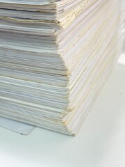 Piles of old papers were stacked on top of each other.