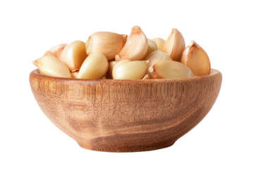 A wooden bowl filled with freshly peeled garlic cloves against a solid black background