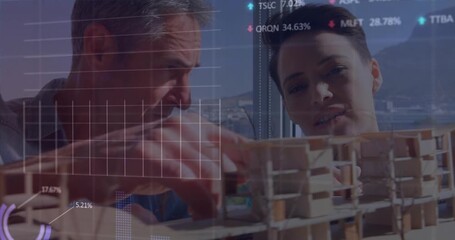 A group of architects are discussing a building model in their office - Powered by Adobe