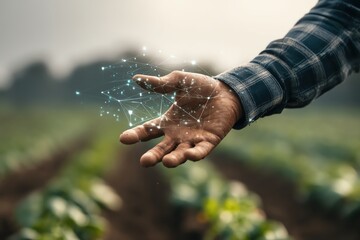 Hand connecting nature with technology.