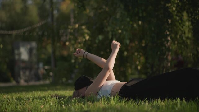 white female dancer practicing playful floorwork in park breakdancer warming up, street performer experimenting with arm and leg combos, student polishing routine, dynamic kicks and balance work,