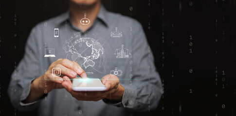 Artificial intelligence integration in mobile technology, smart applications, data flow, and global connectivity. A man using smartphone with digital globe and AI icons on binary code background.