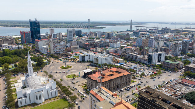 Aerial view of a vibrant cityscape where modern skyscrapers meet historical buildings under a vast sky, Maputo, Cidade de Maputo, Mozambique.