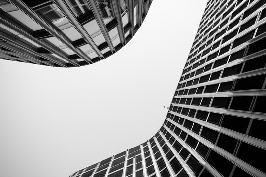 Abstract monochrome modern architecture with sweeping curve, lines and pattern, bold geometry and structure in deep perspective for design use