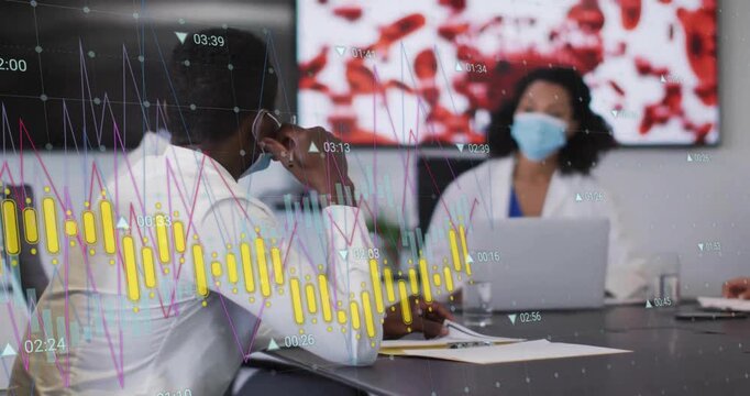 Man scanning medical documents with flickering graphs, gesturing at woman pointing red cell imagery