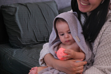 Mother and Cute Baby Bonding with Glowing Toy