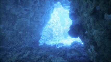 Waves gently flow through a stunning underwater cave where brilliant light filters in, creating a...
