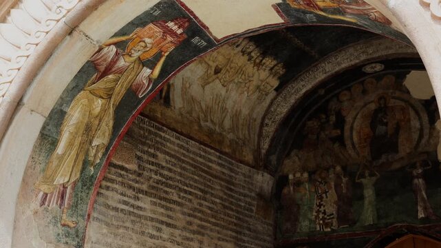 Orthodox fresco in Zica Monastery, Serbia. Saint carries the symbol of the church. Travel to historical places of Europe. High quality 4k footage