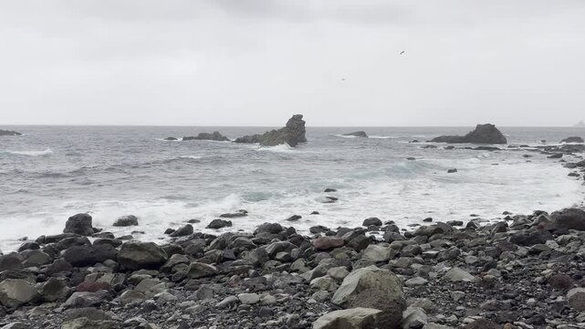Rainy view of Alm&aacute;ciga Beach and ocean near Taganana, Tenerife