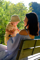 Mother and Child Enjoying a Sunny Day in the Park.