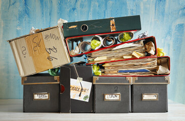 Stack of grungy messy file folders,paperwork and ring binders. Business concept,beat the clock,bureaucracy, active business