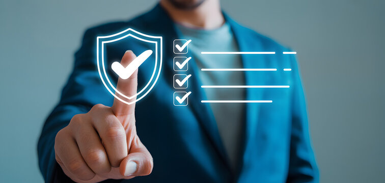 Man in blue suit jacket interacting with virtual shield and checklist icons on finger - Powered by Adobe