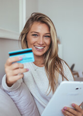 Happy Woman Shopping Online At Home With Credit Card And Tablet