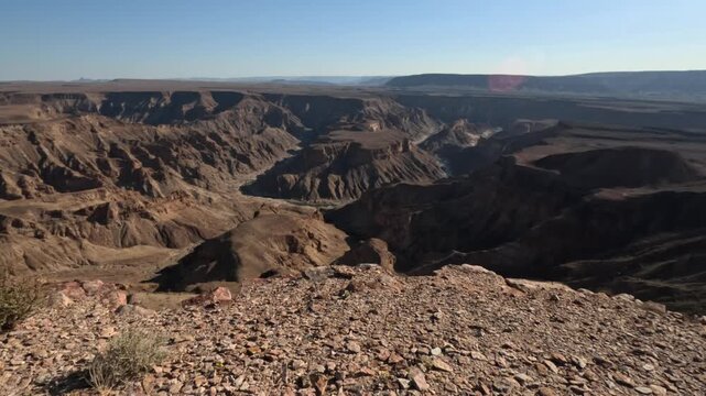 Walking at ege of Fish River Canyon - the second largest canyon in the world, South Namibia, Africa