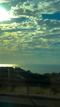 Diseminados, 24B, 03560 Campello, Alicante, Spain
10/20/2025.
View from the car. Road in Spain on a sunny day. sunset over the river