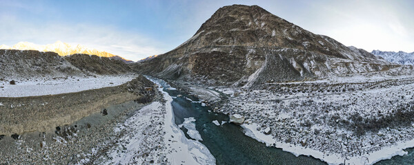 a beautiful mountain river in a snowy gorge. highlands. winter in the mountains