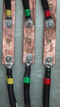 Electrical wiring connections, industrial copper busbars power supply panel close up