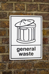 General Waste Sign With Trash Bin Icon on Brick Wall