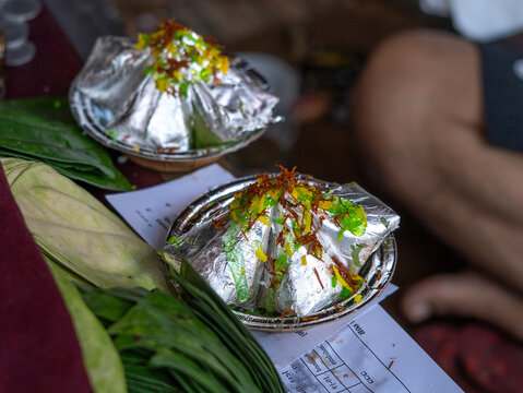 Image of betel leaf or sweet Paan preparation in a street market of Banaras.