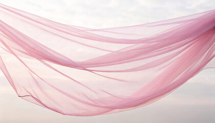 Soft Pink Fabric Flowing Gracefully Against a Cloudy Sky