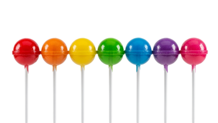 Colorful round lollipops on sticks against black background