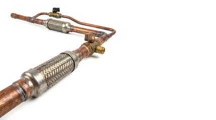 Fototapeta premium Copper pipes with metal fittings and valves