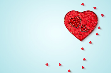 Heart-Shaped Candy Arrangement on Light Blue Background for Valentine's Day