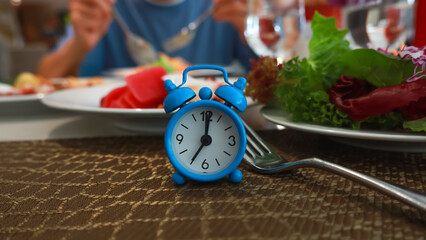 Blue Alarm Clock Waiting for the IF Meal Intermittent Fasting Concept