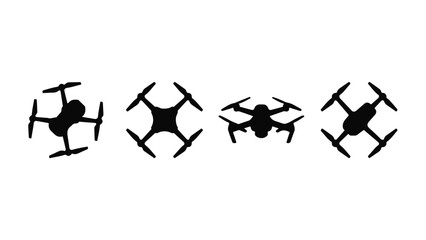 Four black drone quadcopter silhouettes on white background for technology © StockStudio