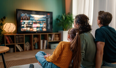 family watching  TV at home
