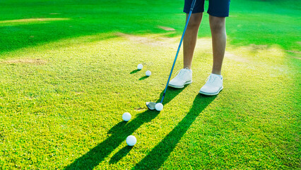 Golf practice session at a luxury course during late afternoon sunlight
