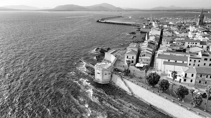 Aerial perspective of Alghero, showcasing the Mediterranean beauty on a warm afternoon