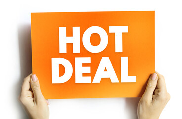Hot Deal text on card held by hands. Concept image symbolizing promotion, sale, offer, marketing, or discount campaign for retail, e-commerce, or business advertisement concepts