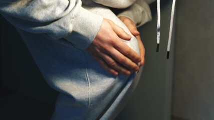 A man in gray pants has a bruised leg.
The man is clutching his knee and experiencing pain from arthritis.
Calcium deficiency in the bones and knee pain