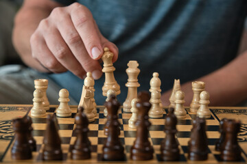 the hand moves the chess pieces