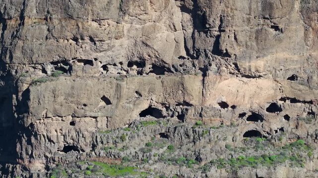 Aerial view of Highlands Mountain Cliffs and Volcanic Topography at Caldera de Tejeda and Artenara, Gran Canaria, Spain - 4K Cinematic Road Trip