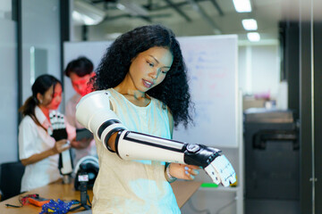 Diverse engineering students team developing robotic technology in laboratory