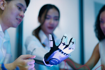 Diverse engineering students team developing robotic technology in laboratory