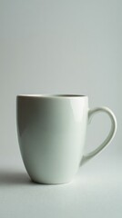 Obraz premium Simple White Mug Against Light Gray Background