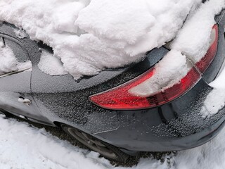 Car covered in a thick layer of white snow